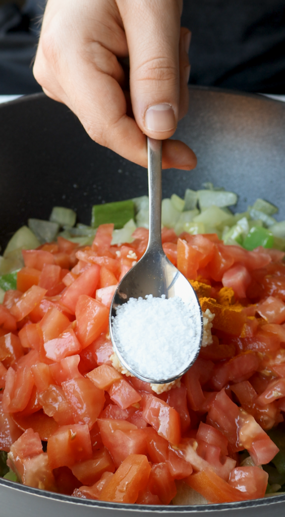 diced onions and green peppers, tomatoes, garlic, turmeric, salt